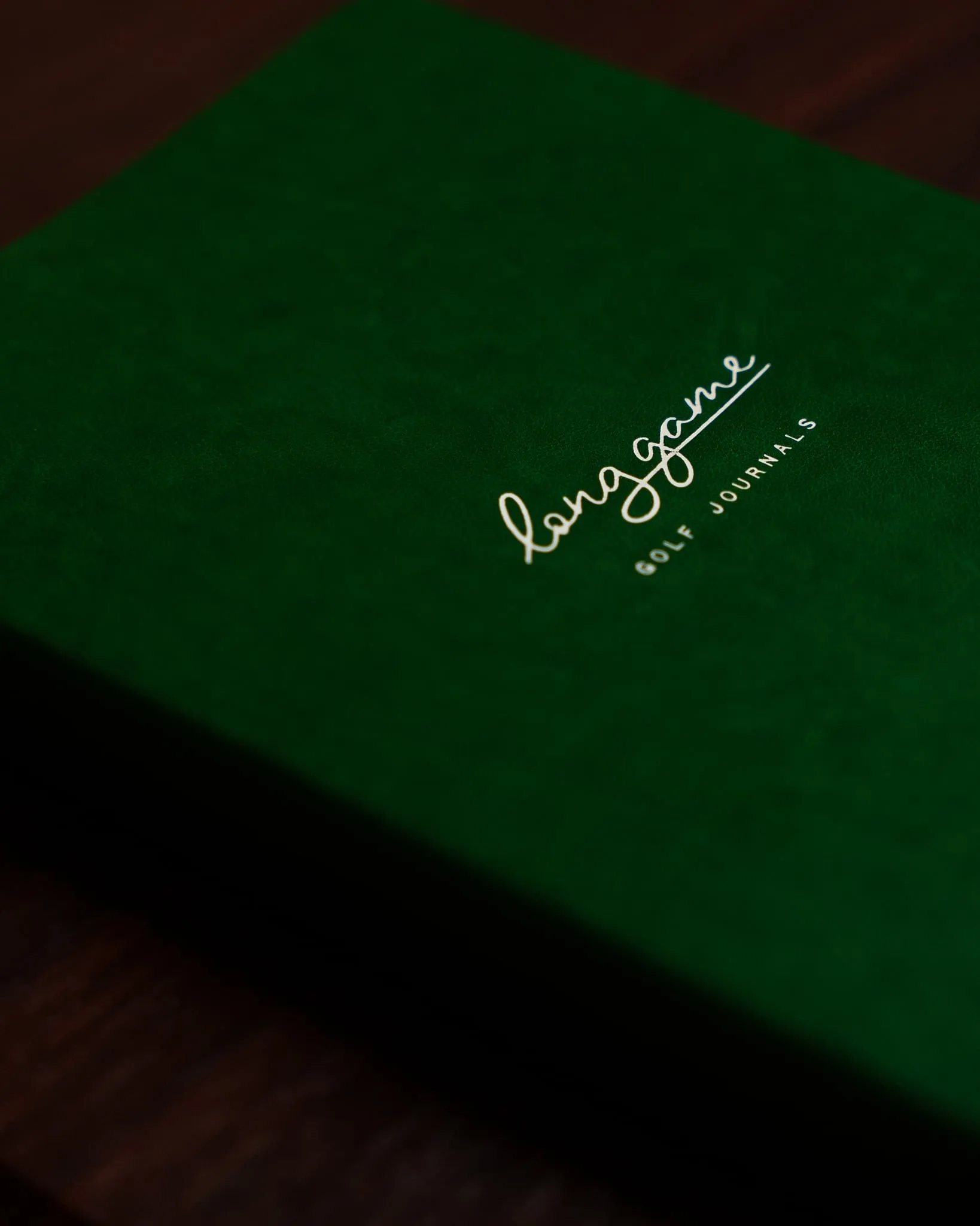 The Planner, green cloth cover with the Long Game mark
