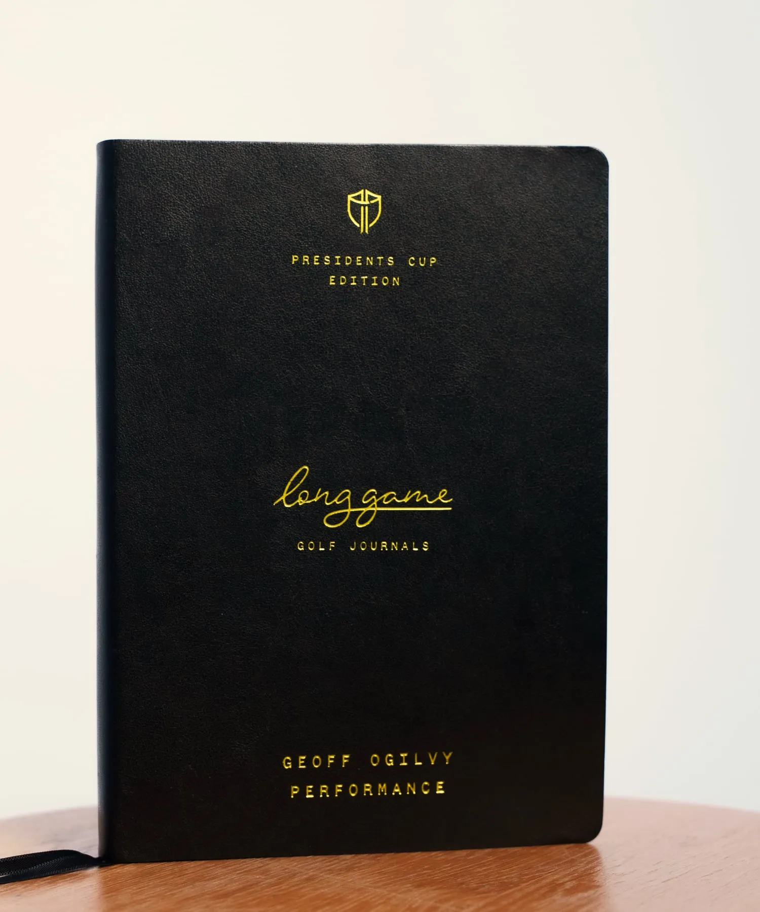 The Performance Journal made for the International Team, black cover, gold crest and lettering